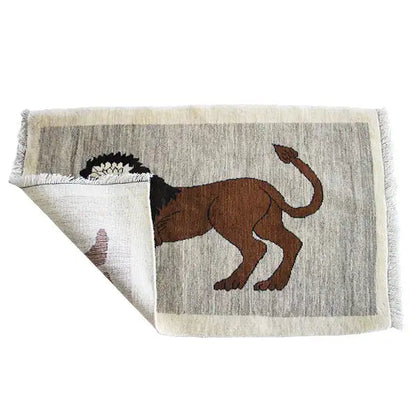 Gabbeh rug with lion motif, edge folded over; brown lion on a light beige background