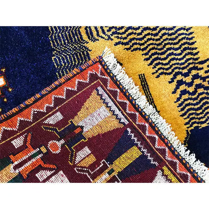 Gabbeh rug detail with geometric patterns, yellow-red areas, and a light pile