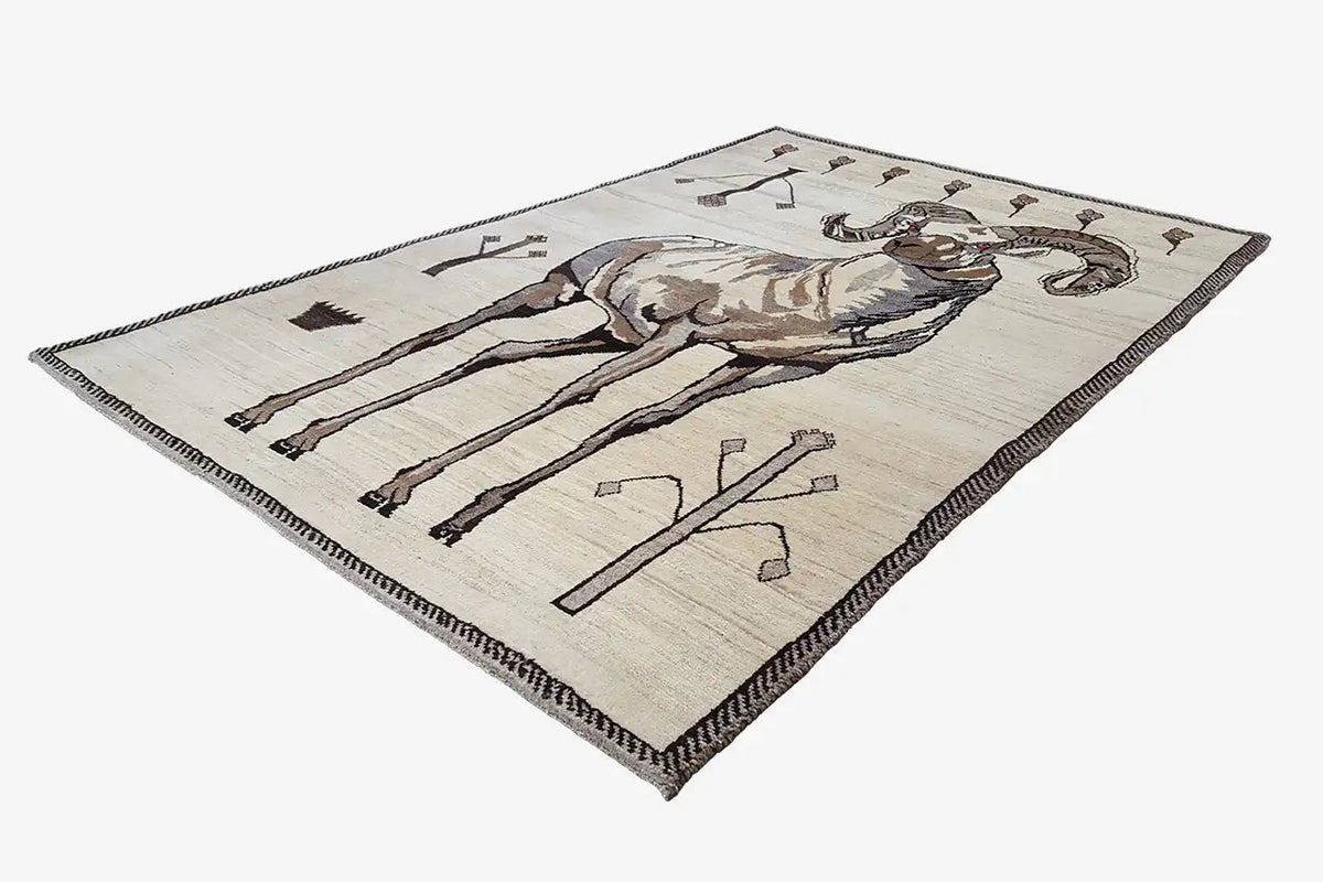 Gabbeh rug with centered lion motif, cream-colored, brown border, and geometric symbols