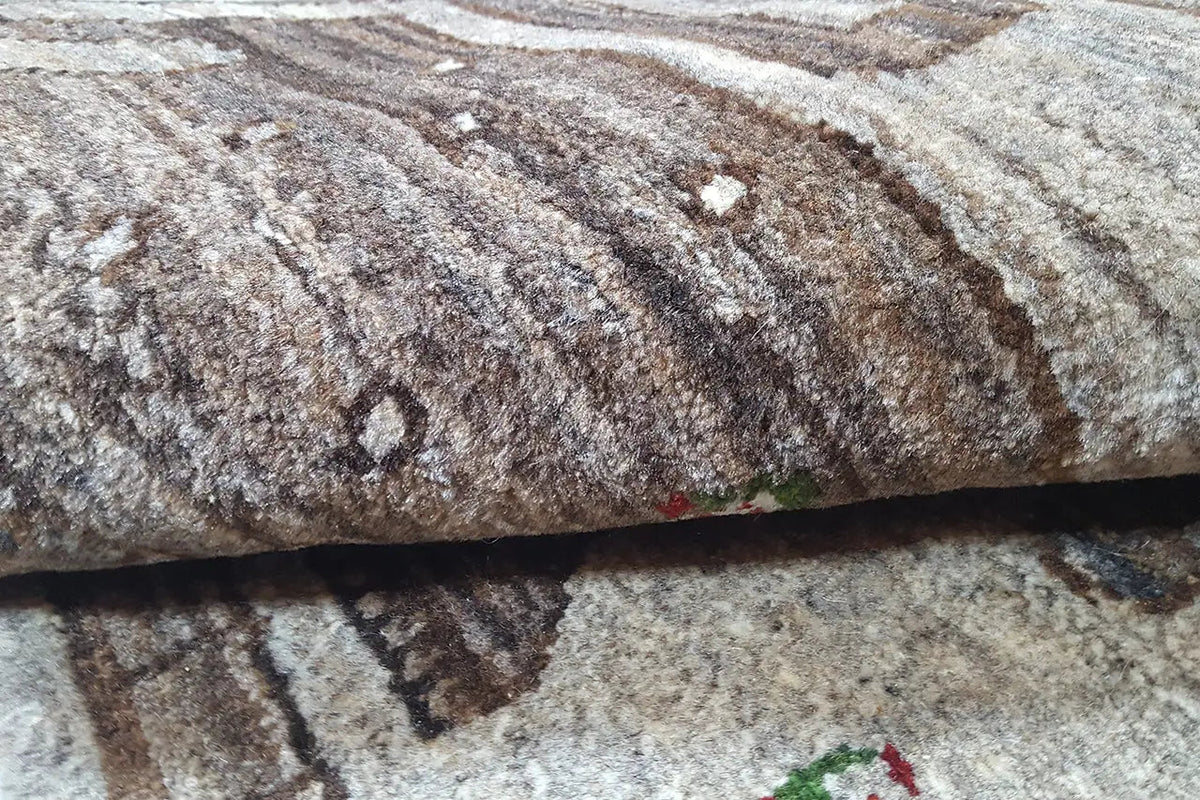 Gabbeh rug pile close-up, brown-beige with a dense, textured surface