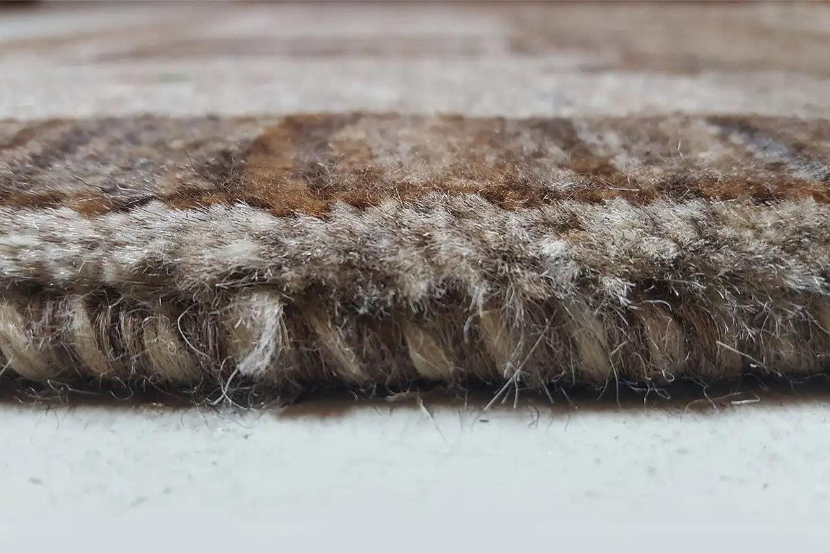 Gabbeh rug edge detail with dense pile and irregular texture