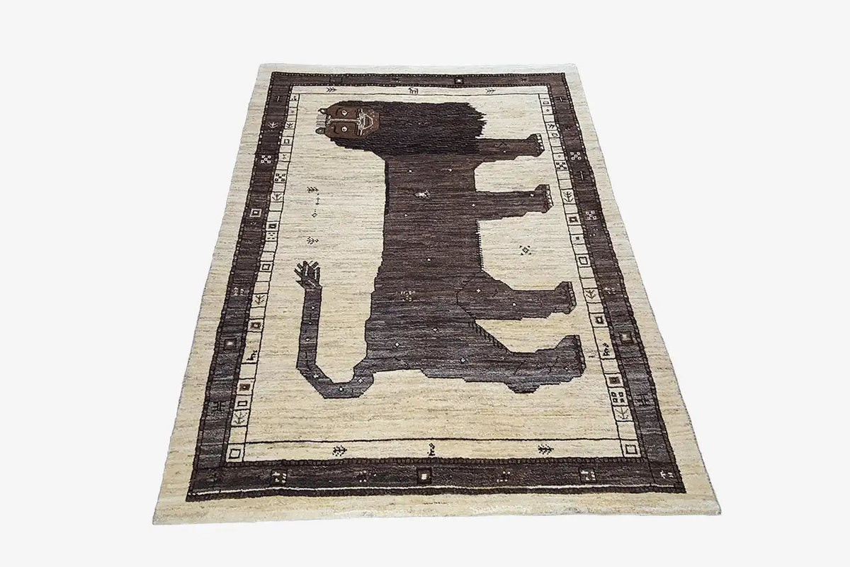 Gabbeh rug with a contrasting lion pattern and dark rectangular border