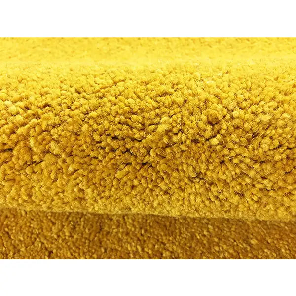 Mustard yellow Gabbeh rug, close-up of the dense pile and texture