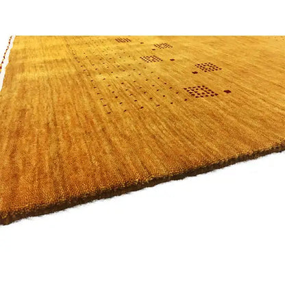 Gabbeh loom rug with a flat pile and a row of small dark square patterns