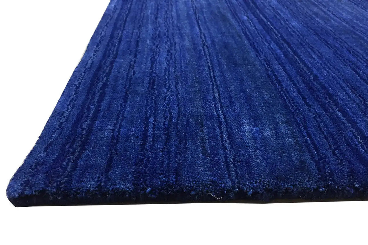 Gabbeh rug 245x156 cm, blue pile design with clear longitudinal stripes and a rounded corner area