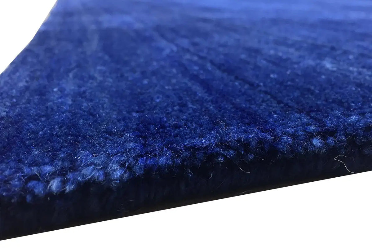 Gabbeh rug 245x156 cm, detail of the edge with a blue pile finish