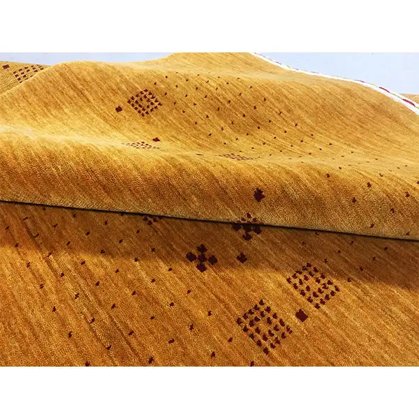 Gabbeh handwoven rug (180x121 cm) with a mustard-yellow field and dark square patterns