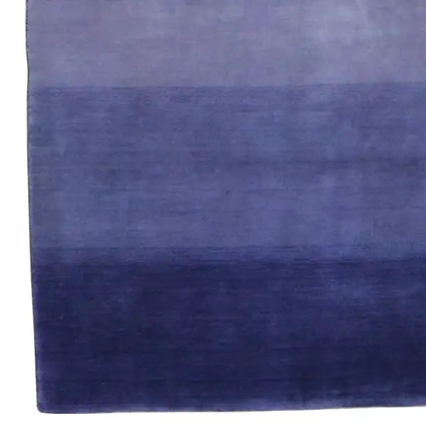 Gabbeh rug with a blue/violet striped pattern, rectangular, smooth surface.