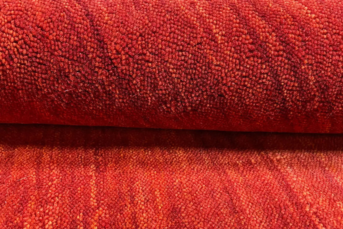 Close-up of a Gabbeh rug, vibrant red, dense pile and edge