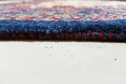Classic rug edge with dense pile and a contrasting fringe line