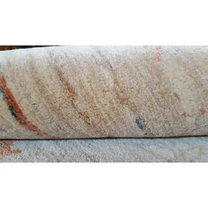 Close-up: beige carpet surface with a multicolored patterned stripe