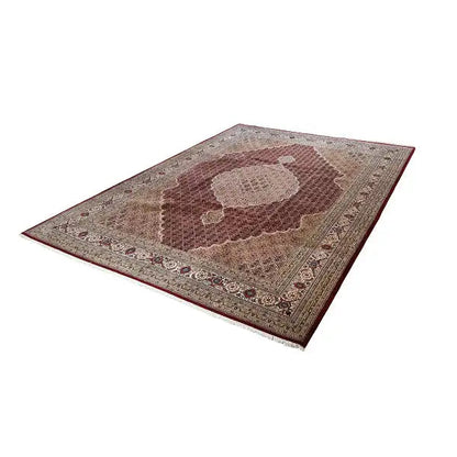 Rug with brown medallion and beige border in an ornamental pattern