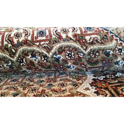 Indo Tabriz carpet close-up with floral patterns in multiple colors