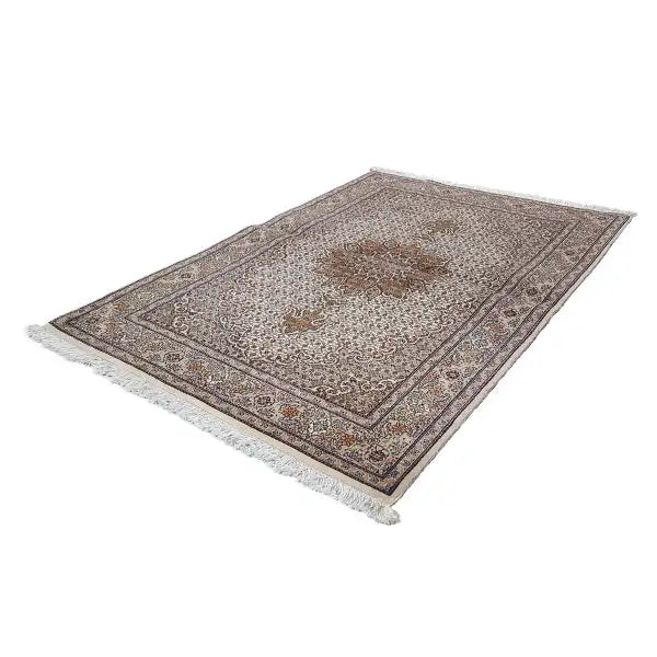 Flat-woven rug with a beige background, dark border, and central ornament