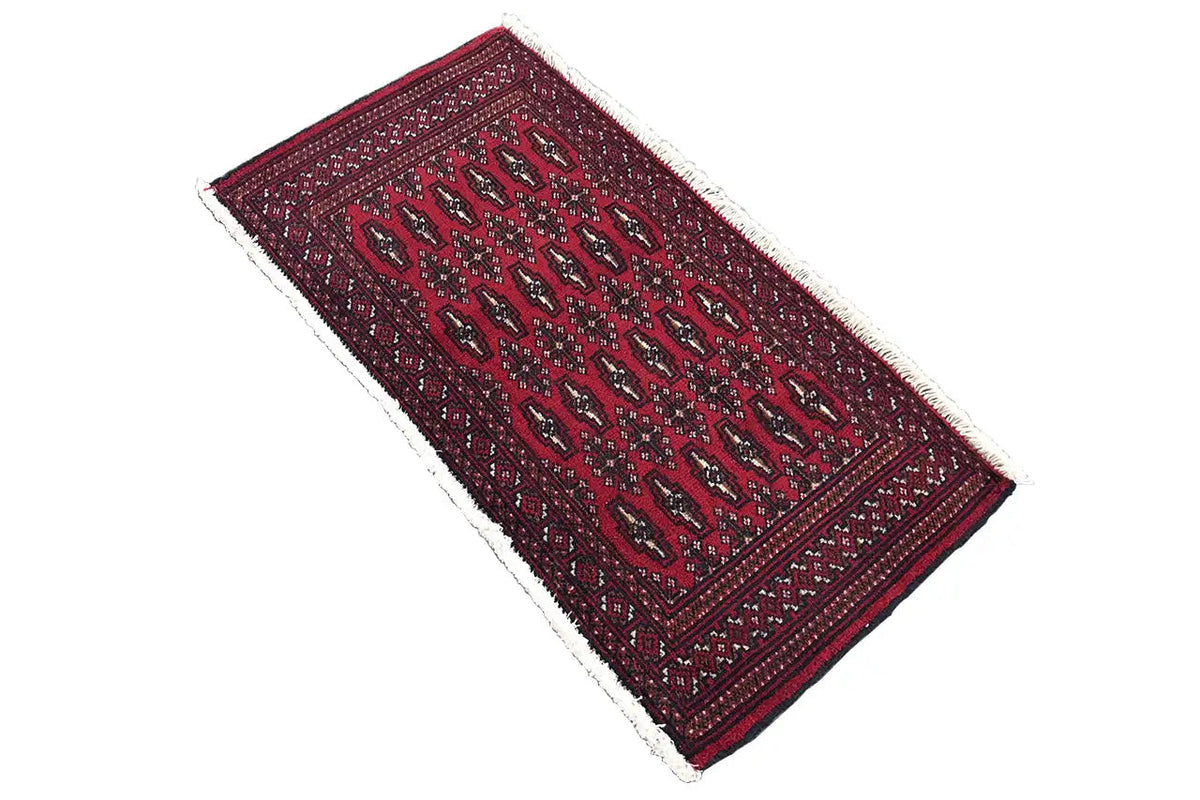 Turkmen rug 110x51 cm, dark red, diagonal view with finely patterned rectangles