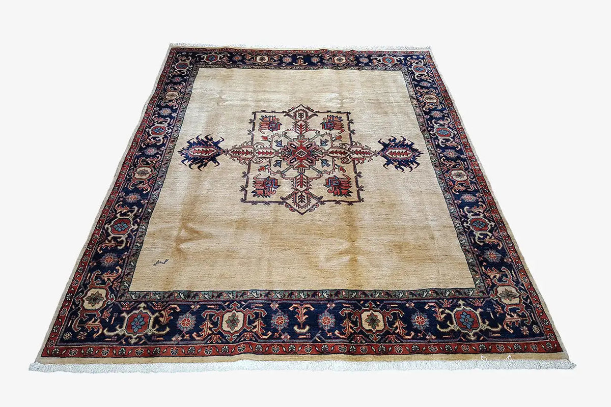 Rectangular Heriz rug, cream field with a red-and-blue central ornament and border
