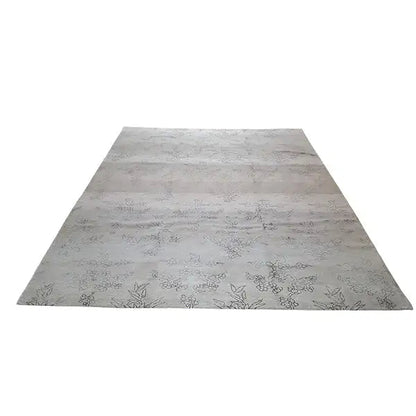 Designer rug with Bo Hamsa: light gray rug with floral ornaments, laid flat