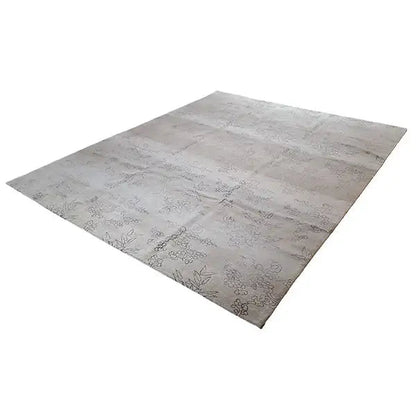 Designer rug with Bo Hamsa: light gray design with delicate botanical ornaments, angled