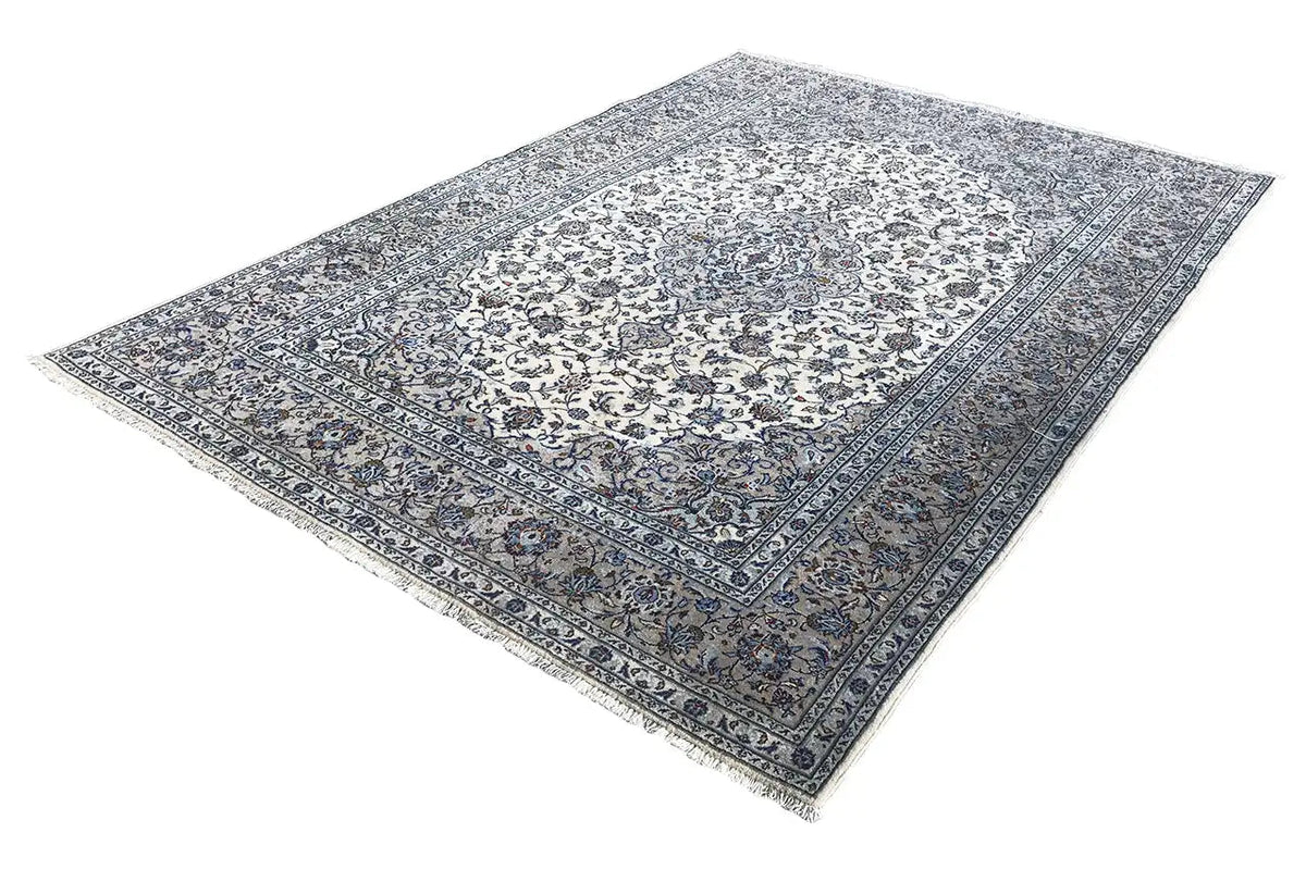 Beige oriental rug with a blue pattern and border, laid flat