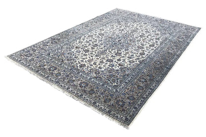 Beige oriental rug with a blue pattern and border, laid flat
