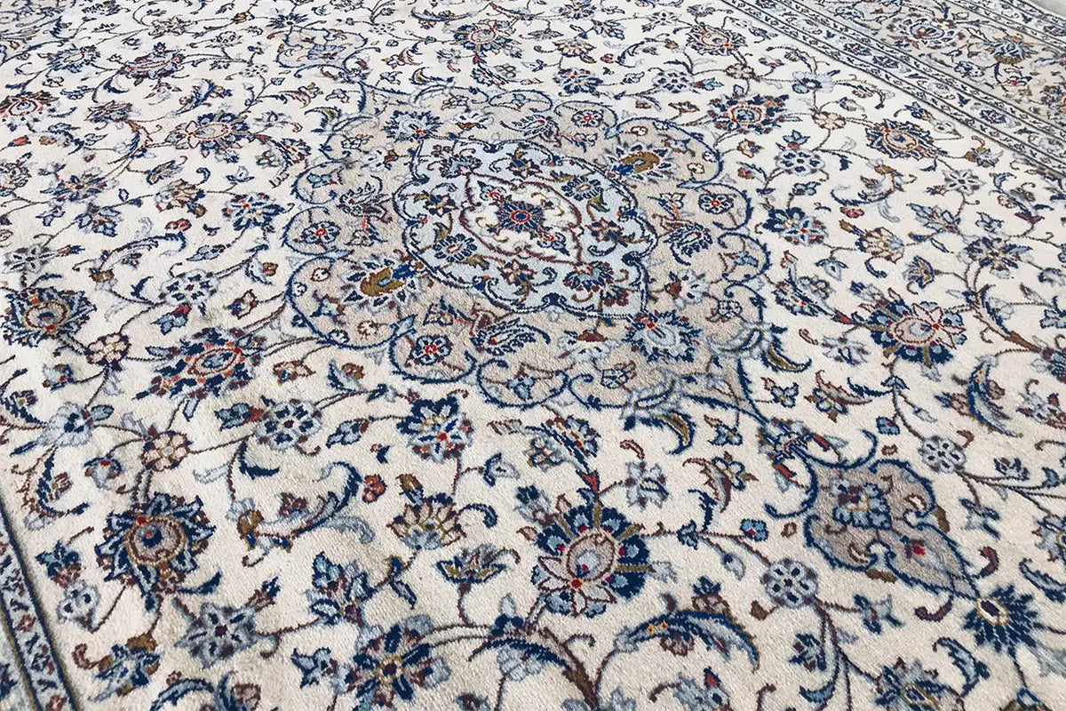 Detail of an Oriental rug: dense ornamental pattern in blue and beige