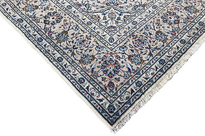Oriental rug corner with matching borders and a blue medallion pattern, neatly finished