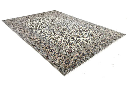 Beige rug with an ornamental medallion pattern, rectangular, with a bound edge