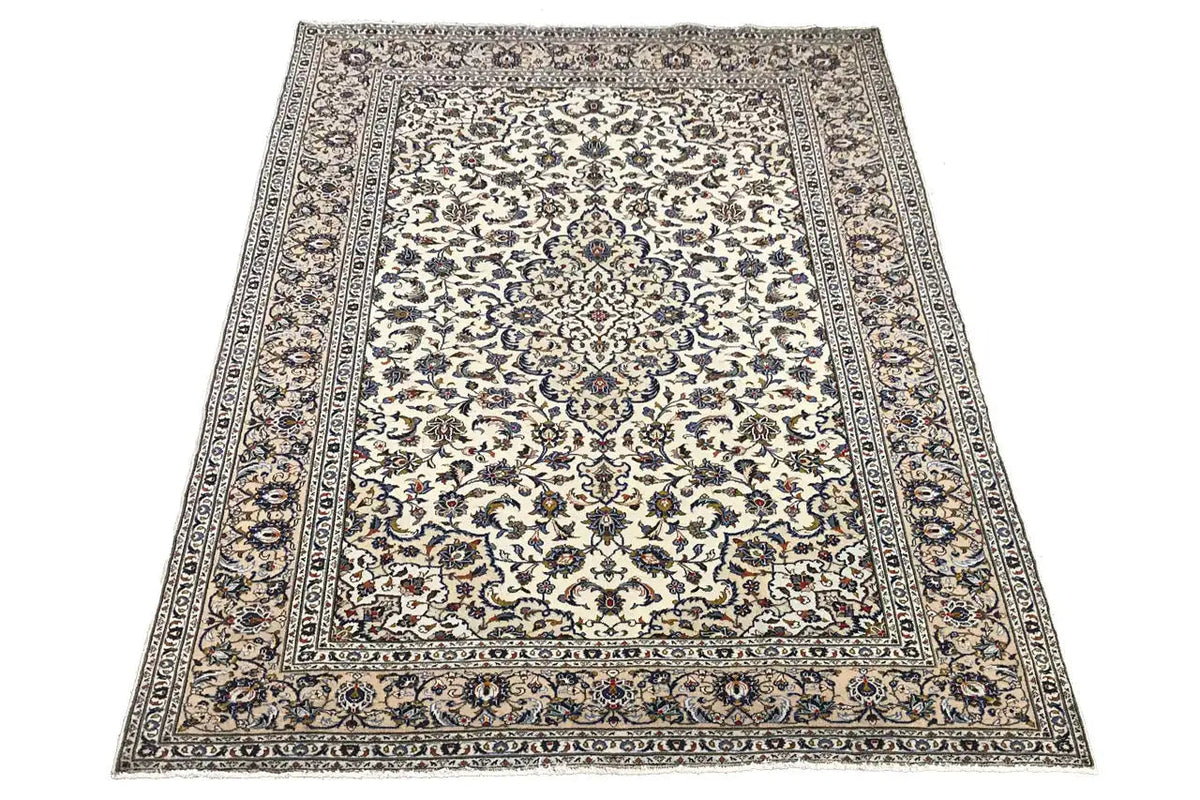 Beige rug with border and detailed ornamentation, central medallion frame