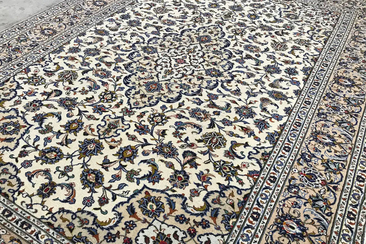 Carpet area with a beige background and blue ornamental design, partial view