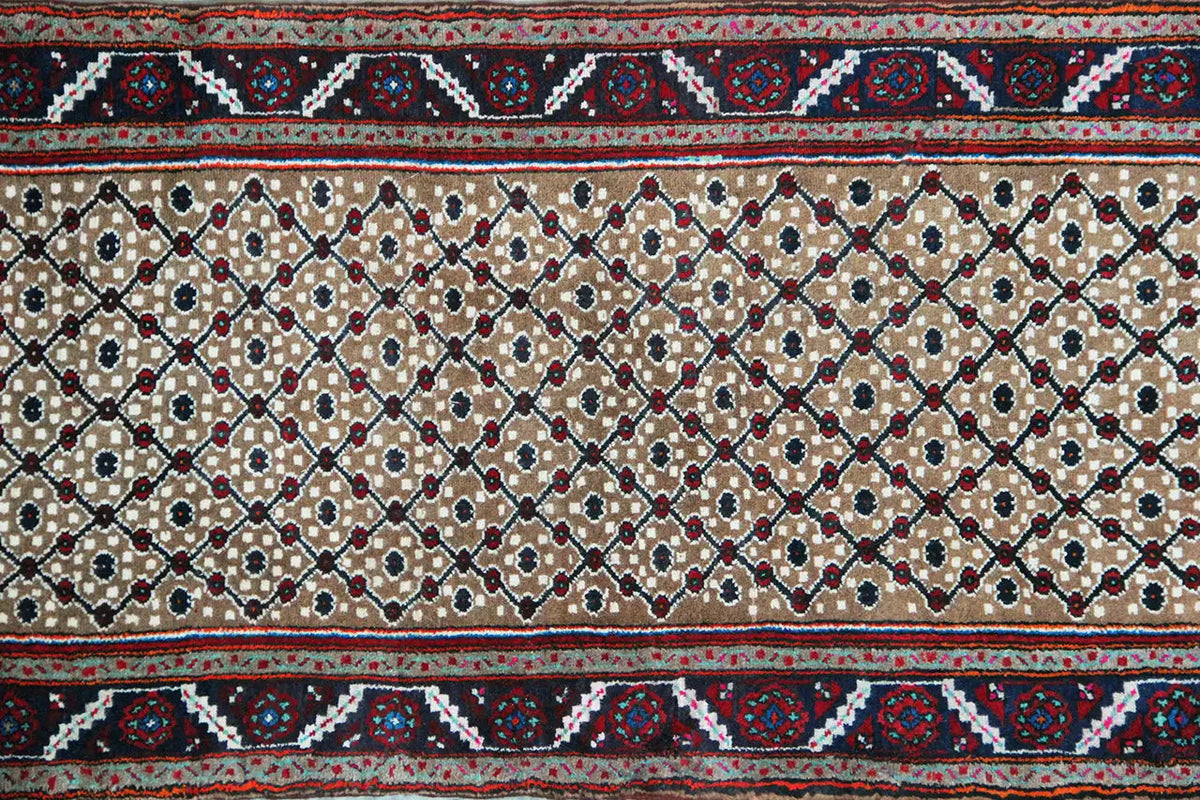 Close-up: Ornaments and medallions on a beige background with a dark blue border
