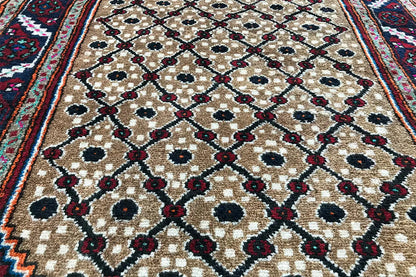Oriental rug runner corner with a blue and burgundy border and beige pattern