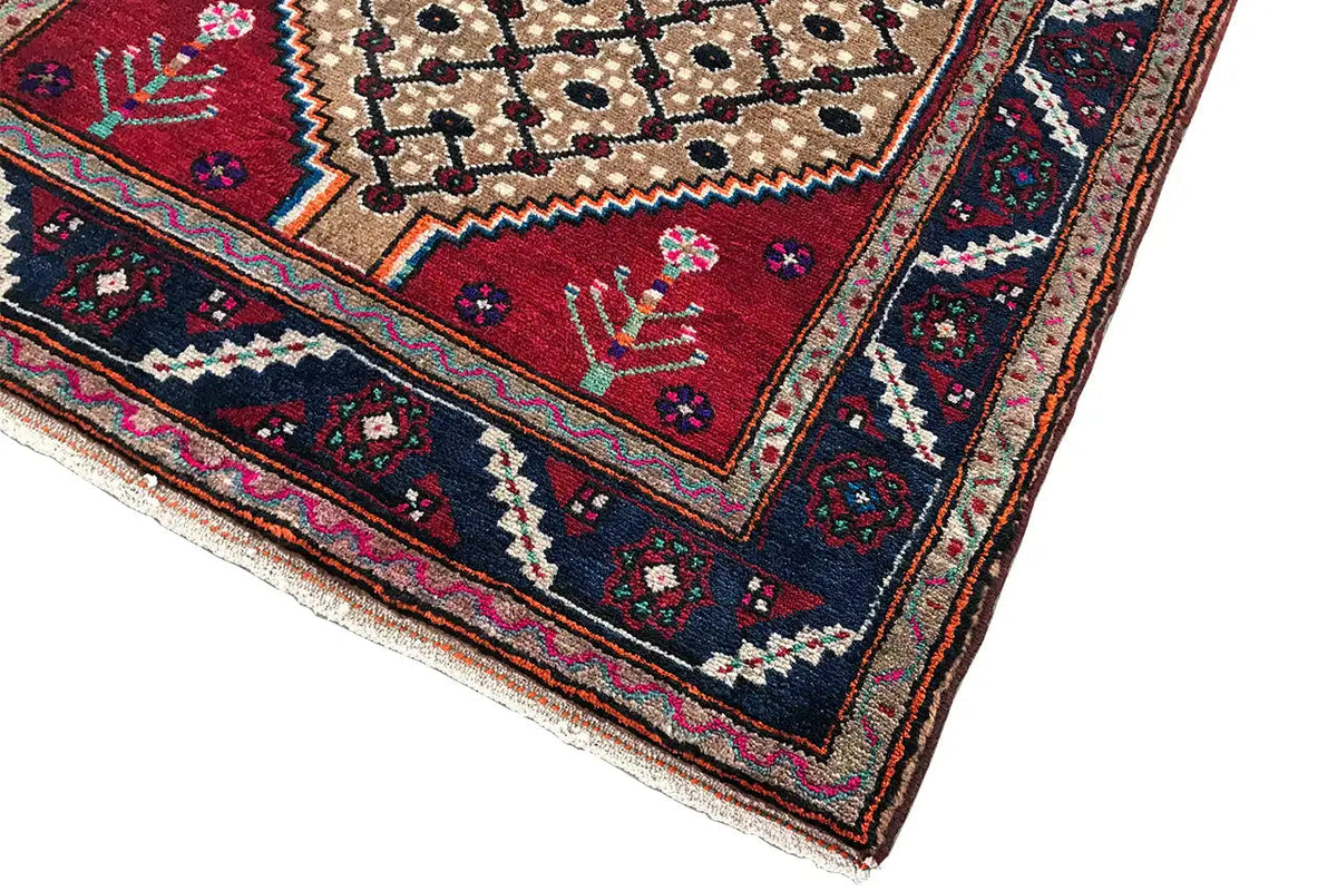 Oriental runner rug with a stepped edge, beige background, and dark decorative border