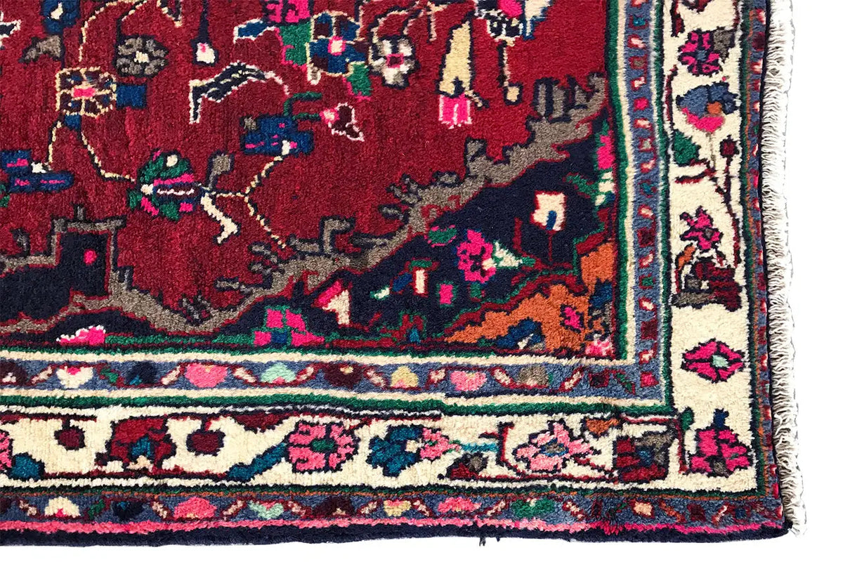 Hamadan runner corner: red pattern, green-blue border band, and colorful decorative trim