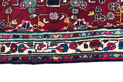 Hamadan runner lower edge with red area, multicolored decorative trim, and patterned border