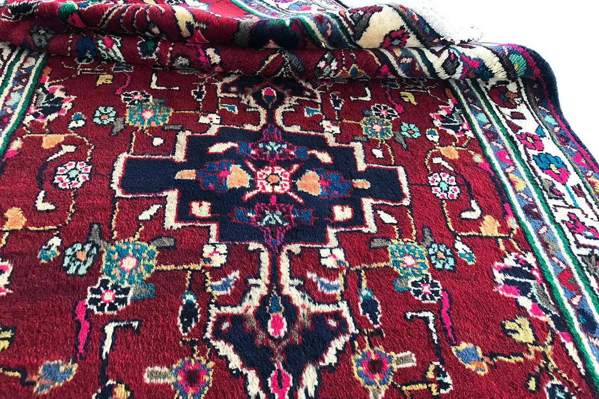 Hamadan runner, curled corner: red pile with ornaments and a blue-green border band