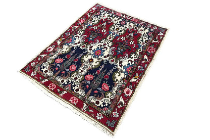 Bakhtiari carpet 142x104 cm, lying at an angle, dark blue-red with a decorative pattern