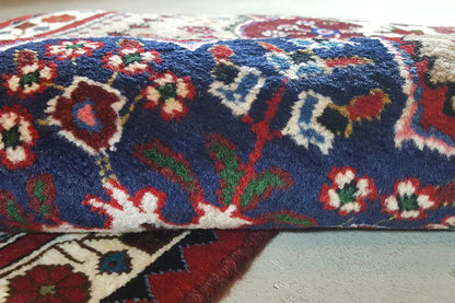 Close-up: runner with a multicolored ornamental pattern on a blue background