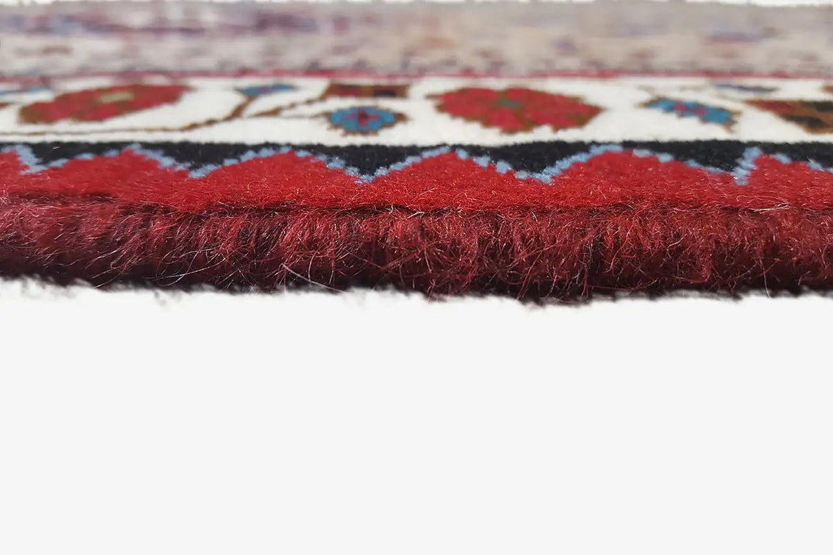 Table runner edge with a short fringe trim in red and blue