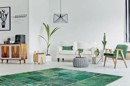 Green patchwork rug with patched rectangles in a vintage look