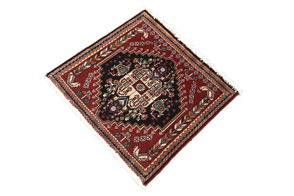 Square oriental rug, burgundy border with a geometric pattern, multicolored accents