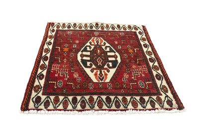Carpet 60x57 cm with a red geometric pattern and white decorative border
