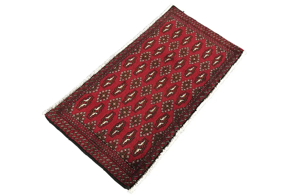 Poshti Turkmen carpet (95x47 cm), red, appearing rolled lengthwise, with a repeating pattern
