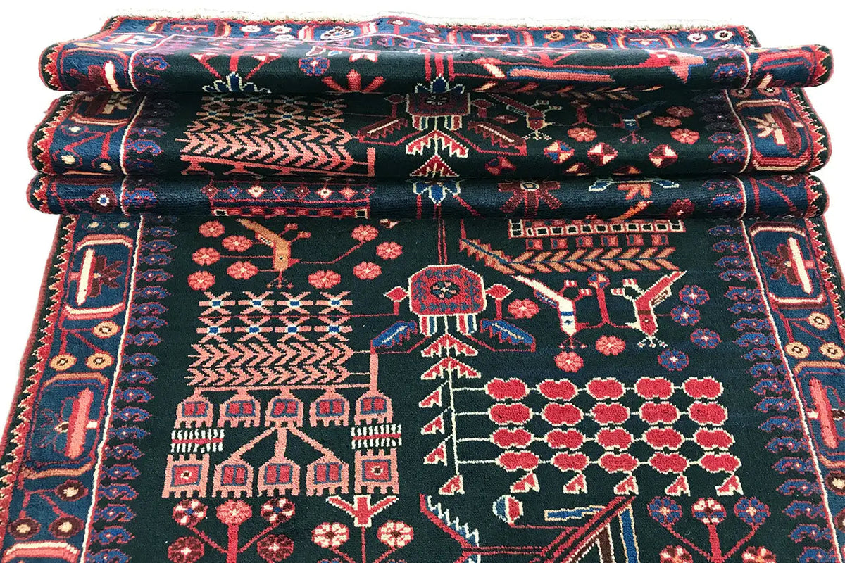 Folded runner rug, multiple layers with a dark pattern and border