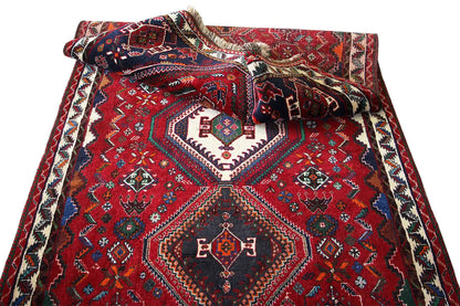 Crumpled Oriental runner rug, red pattern with a central diamond and blue/white decorative border