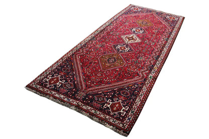 Dark red and navy-blue runner with an ornamental medallion pattern, rectangular