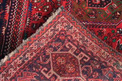 Detailed view: red runner with delicate geometric patterns and fringes