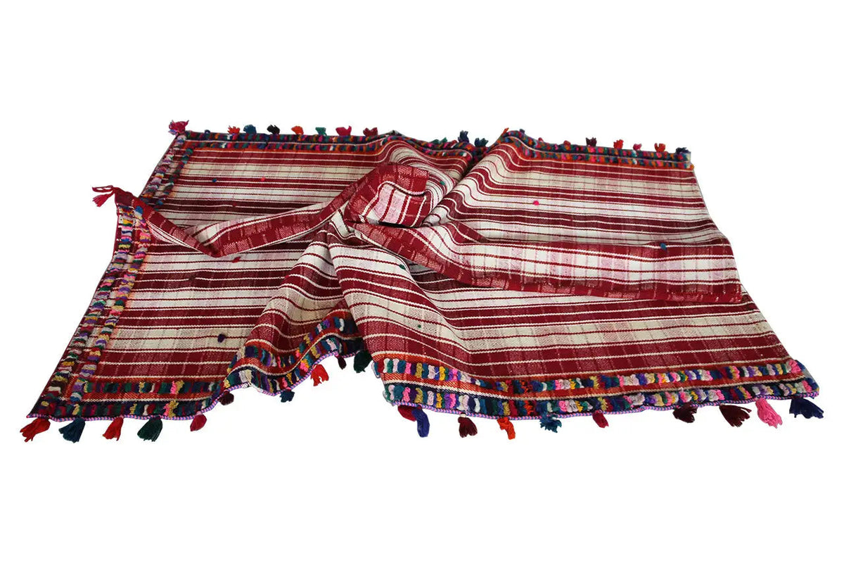 Jajim rug spread out: red-and-white stripes, colorful fringes and border