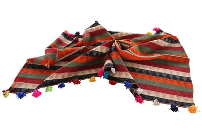 Folded jajim rug: multicolored stripes and tassels along the edges.
