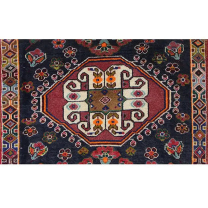 Poschti Qashqai rug detail: round central medallion with colorful symbols