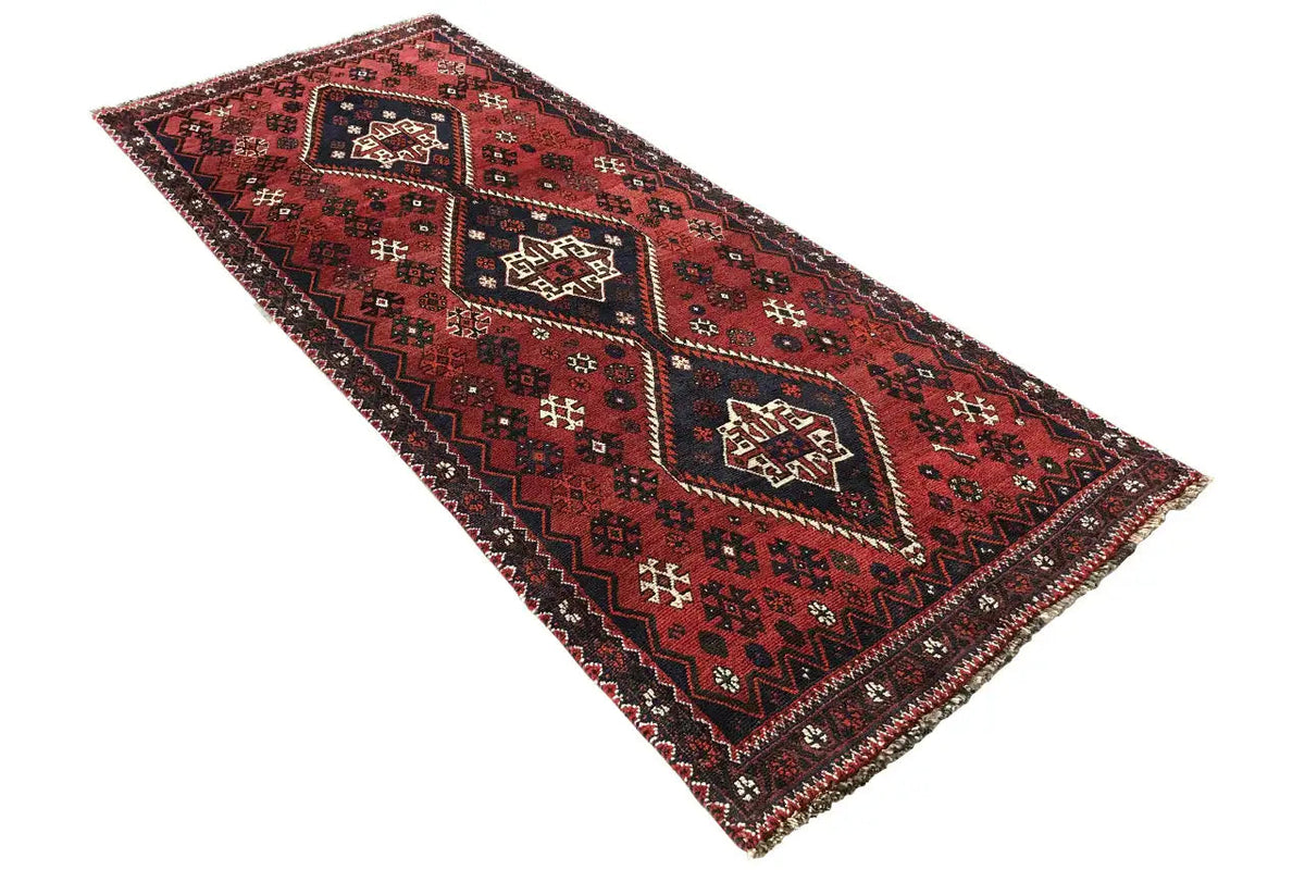 Qashqai runner in red with a black pattern and zigzag border, rectangular